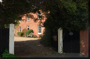 Picture of house through gate